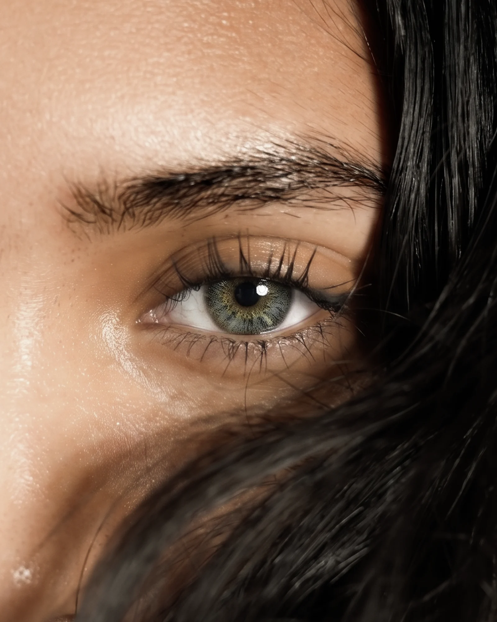 Close crop of glowing skin and eye detail.